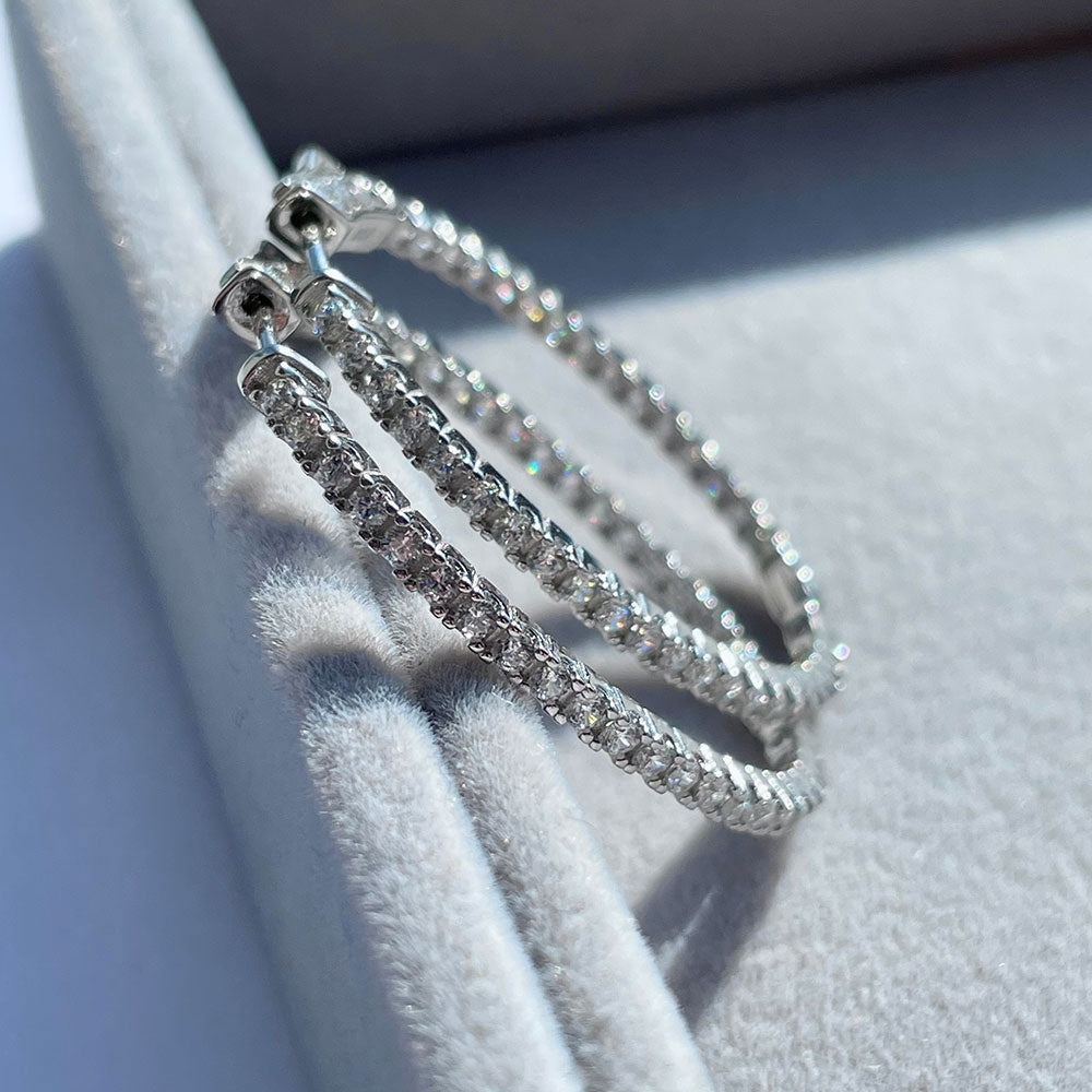 Flatlay view of Oval CZ Inside-Out Hoop Earrings in Sterling Silver 1.4 inch, Rhodium Plated