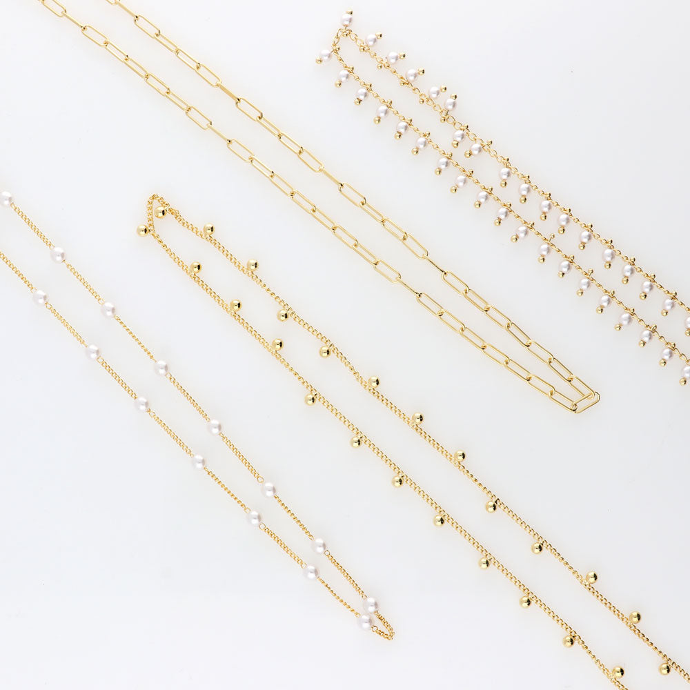 Flatlay view of Bead Station Necklace, Rose Gold Plated