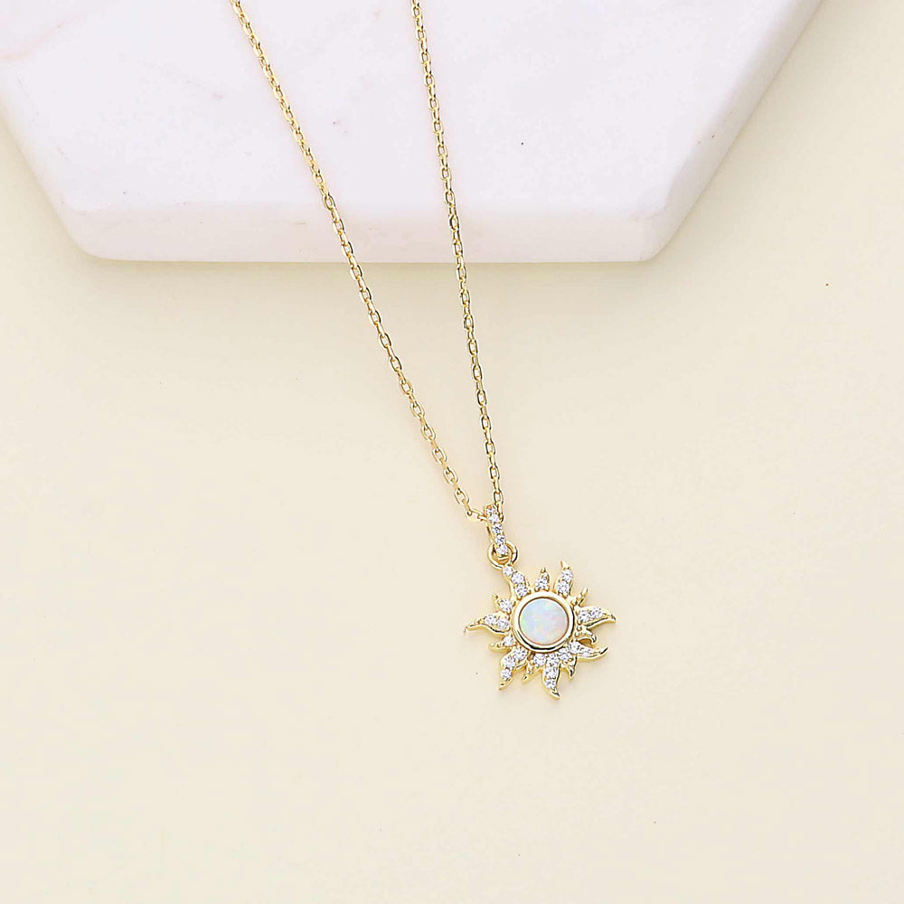 Flatlay view of Halo Sun Simulated Opal Round CZ Set in Gold Flashed Sterling Silver, 7 of 11