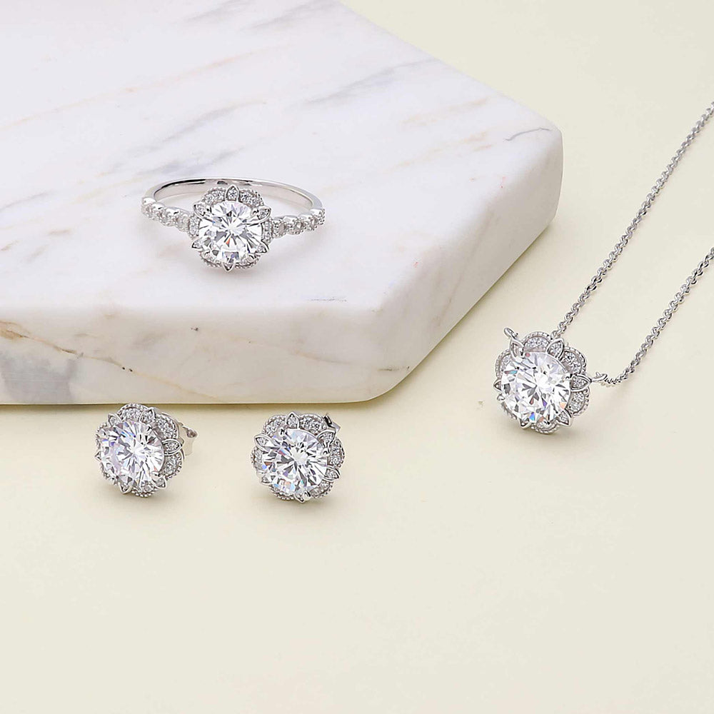 Flatlay view of Flower Halo CZ Necklace and Earrings Set in Sterling Silver, 2 of 9