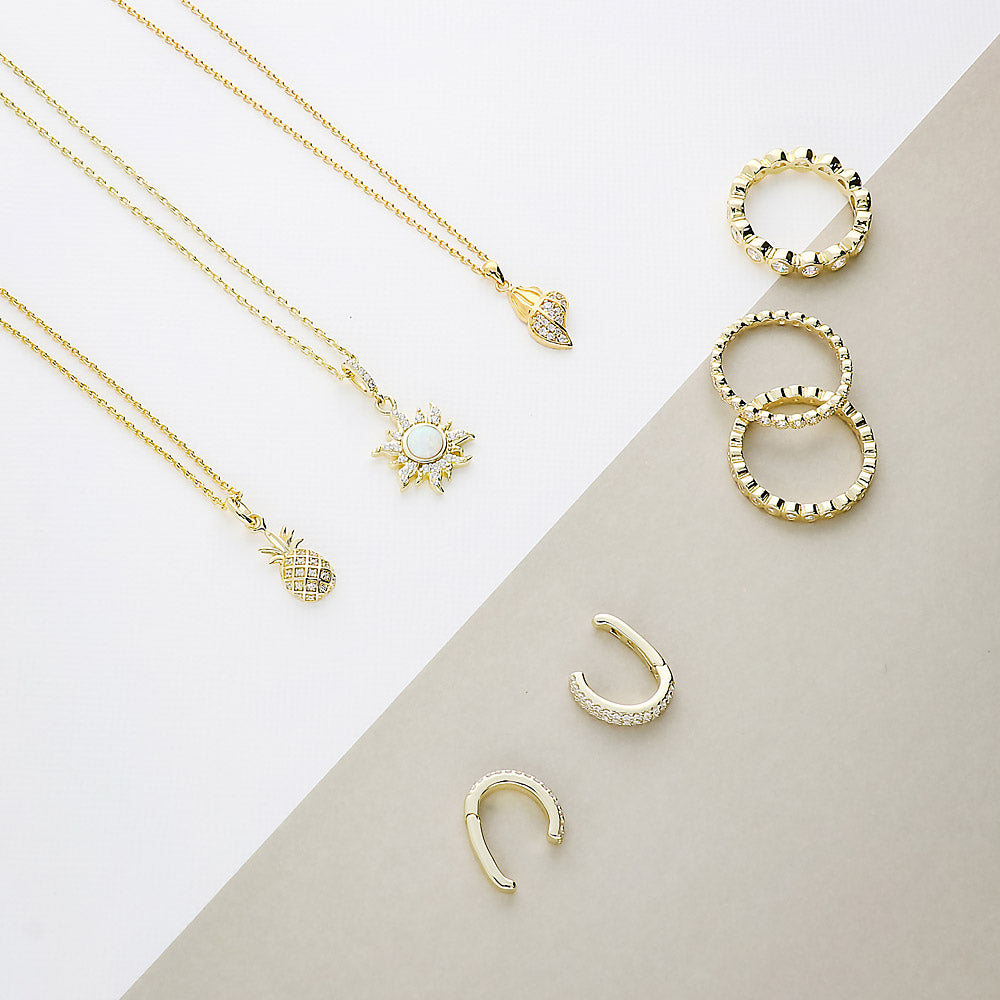 Flatlay view of CZ Ear Cuff Cartilage Earrings in Sterling Silver, Yellow Gold Flashed