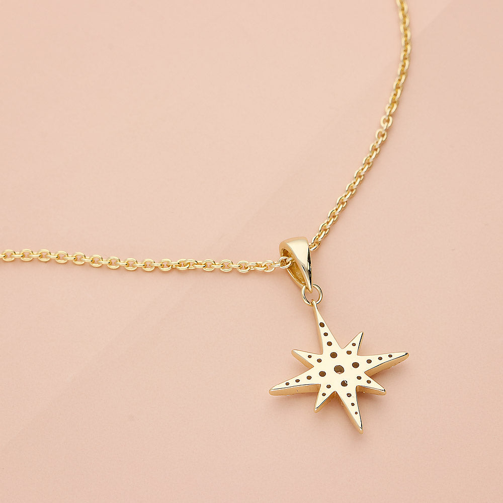 Flatlay view of North Star CZ Necklace in Sterling Silver, Yellow Gold Flashed