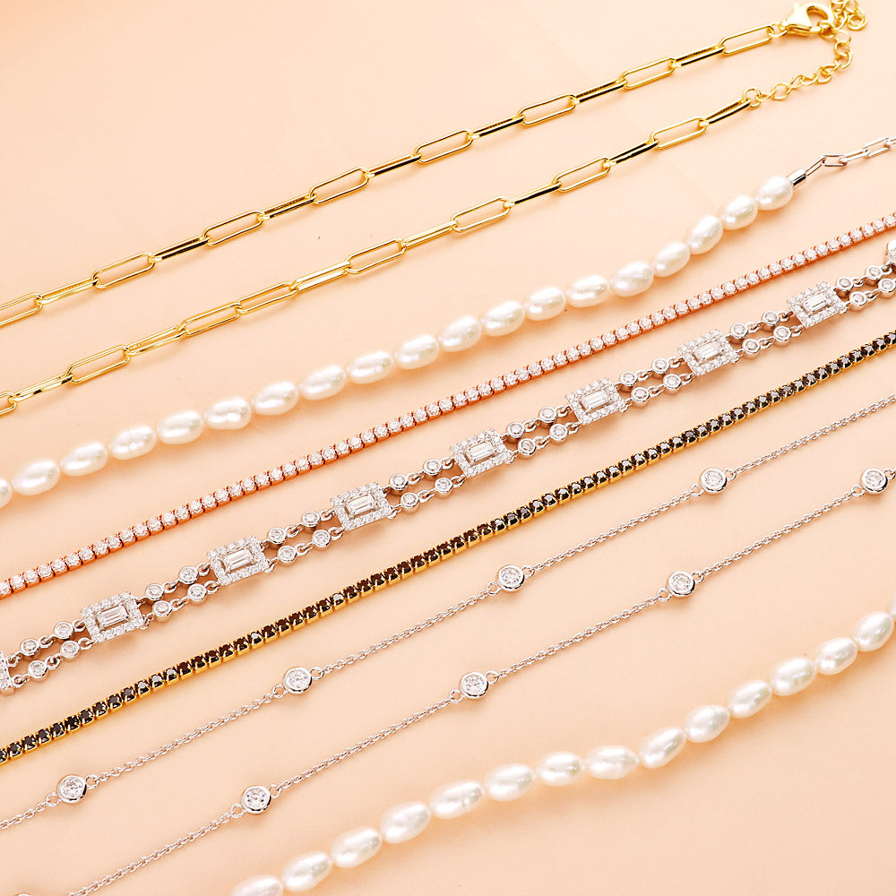 Flatlay view of Station CZ Station Necklace in Sterling Silver, Rhodium Plated / 16 inch + 2 inch extension