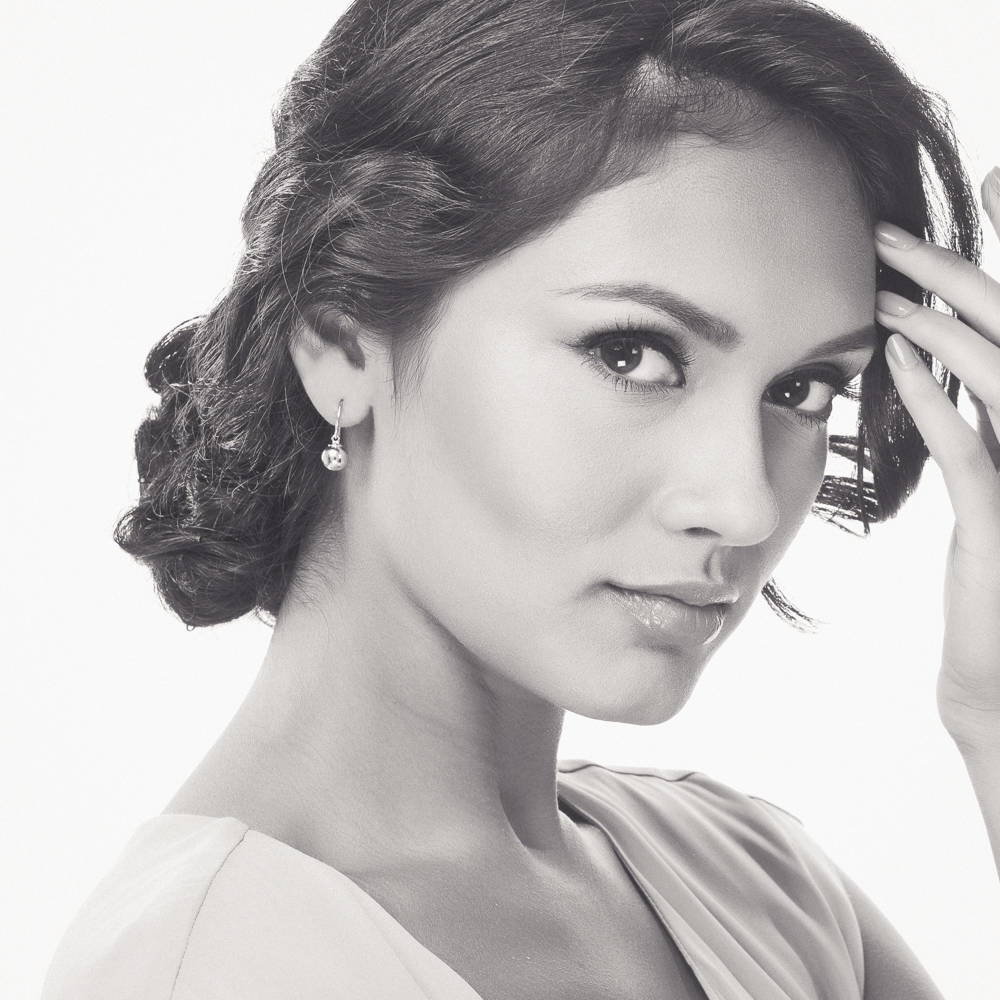 Model wearing Ball Bead Fish Hook Earrings in Sterling Silver, Yellow Gold Flashed