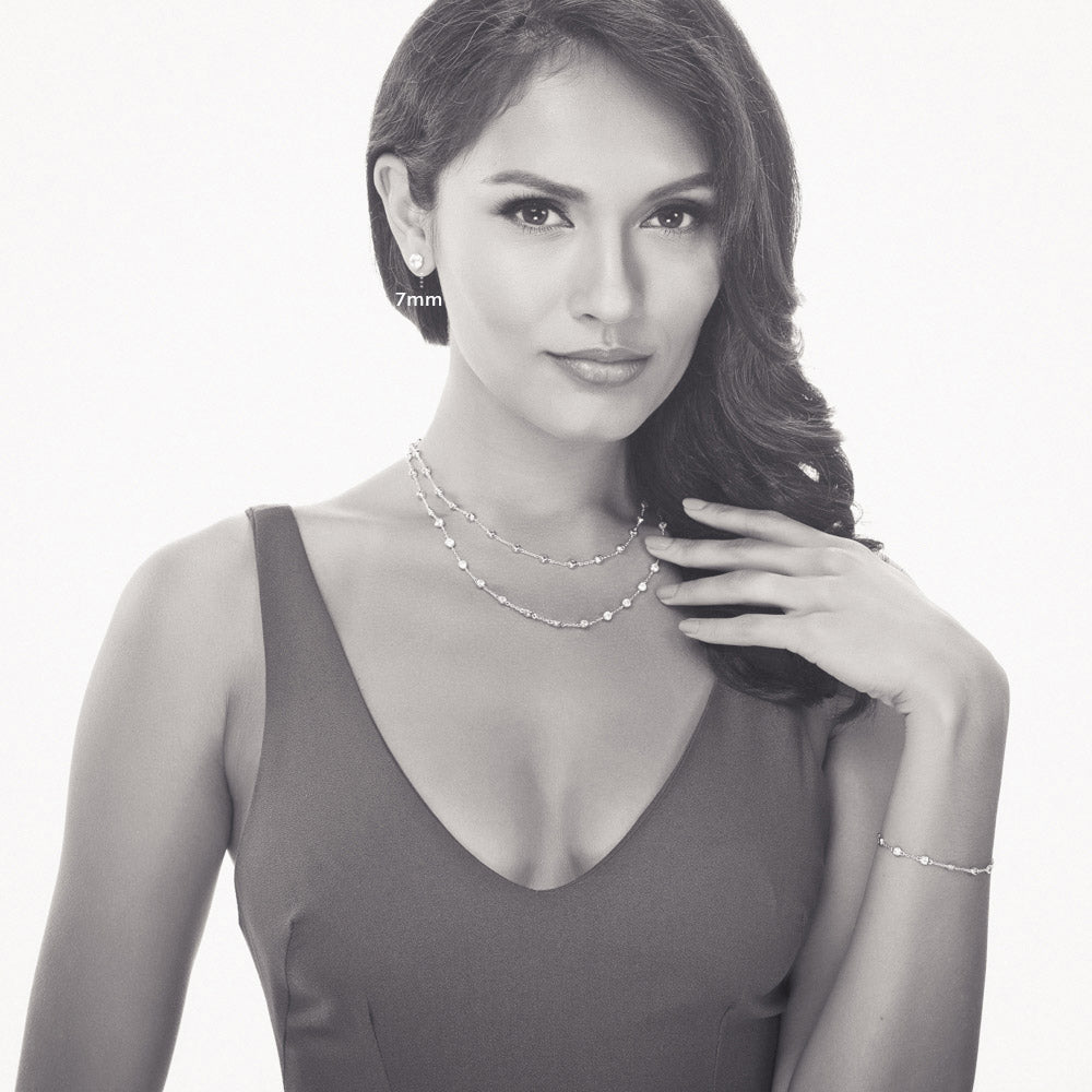 Model wearing Martini Solitaire Bezel CZ Stud Earrings, Rhodium Plated, Clear / 7mm
