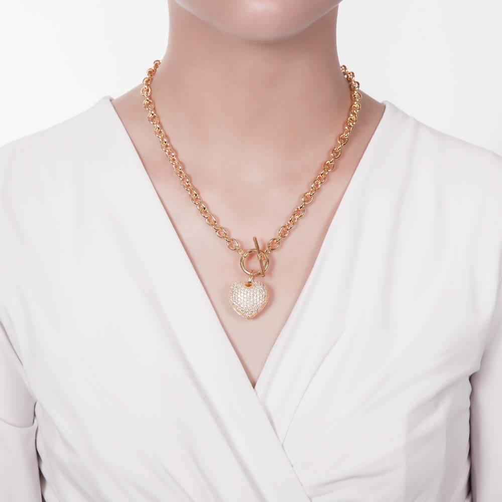 Model wearing Heart CZ Toggle Necklace, Gold-Tone / 18 Inch