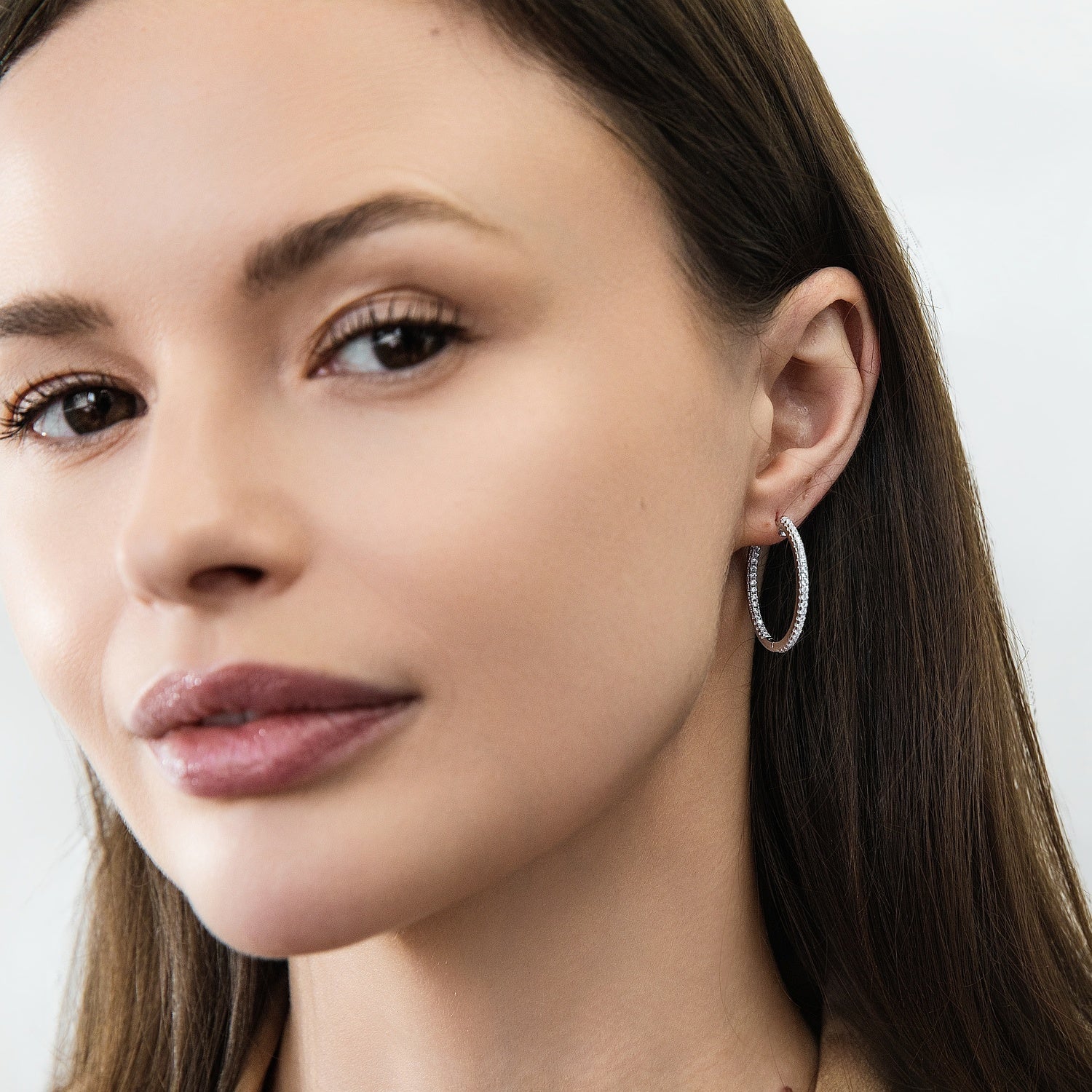 Model wearing CZ Small Hoop Earrings in Sterling Silver, 1 inch