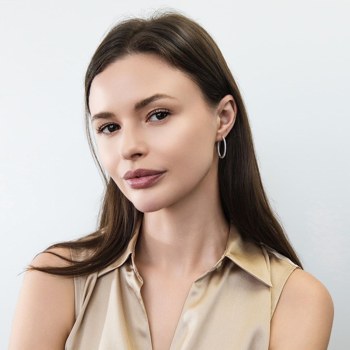 Model wearing CZ Small Hoop Earrings in Sterling Silver, 1 inch
