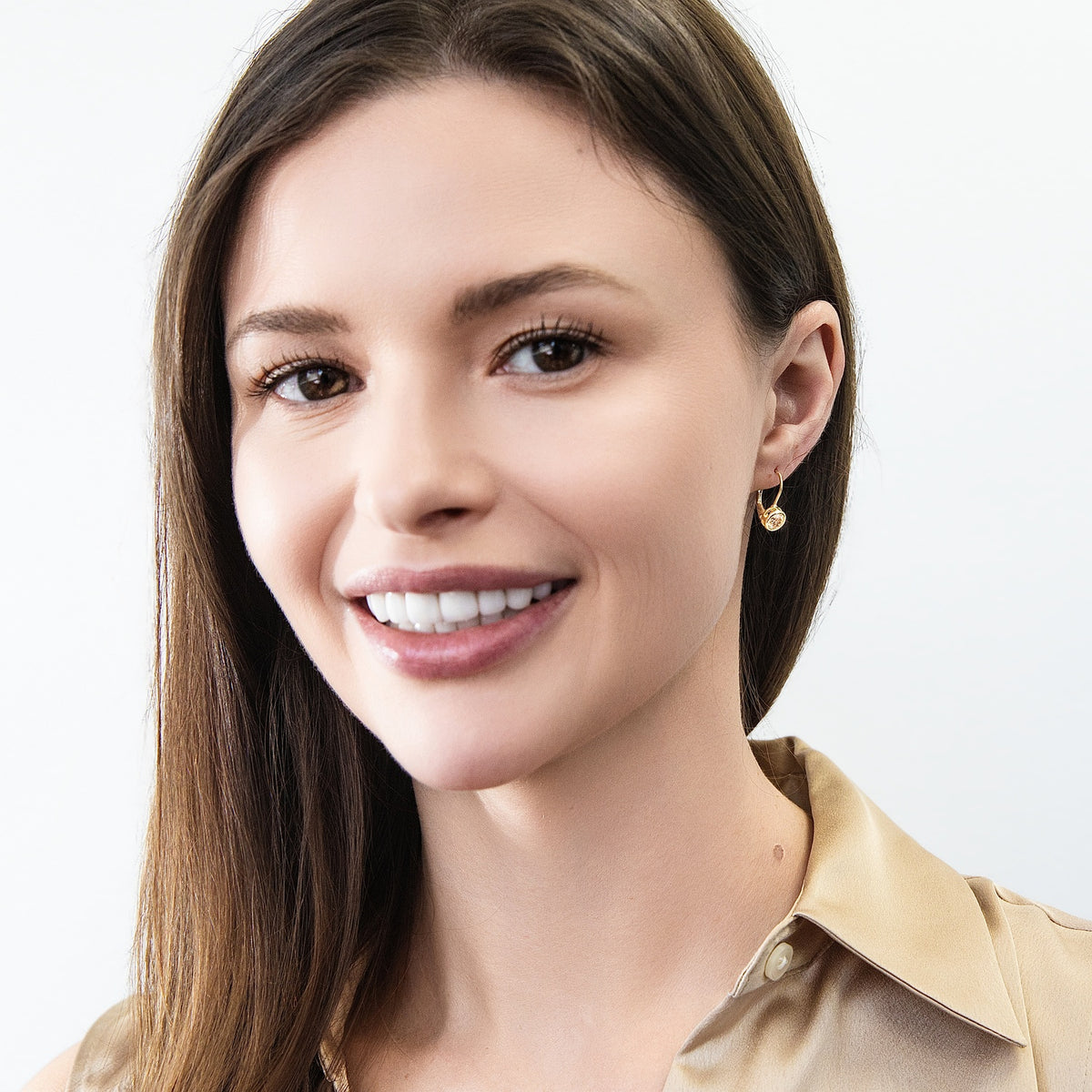 Model wearing Solitaire 1.2ct Bezel CZ Leverback Earrings in Sterling Silver, Champagne, Gold Flashed