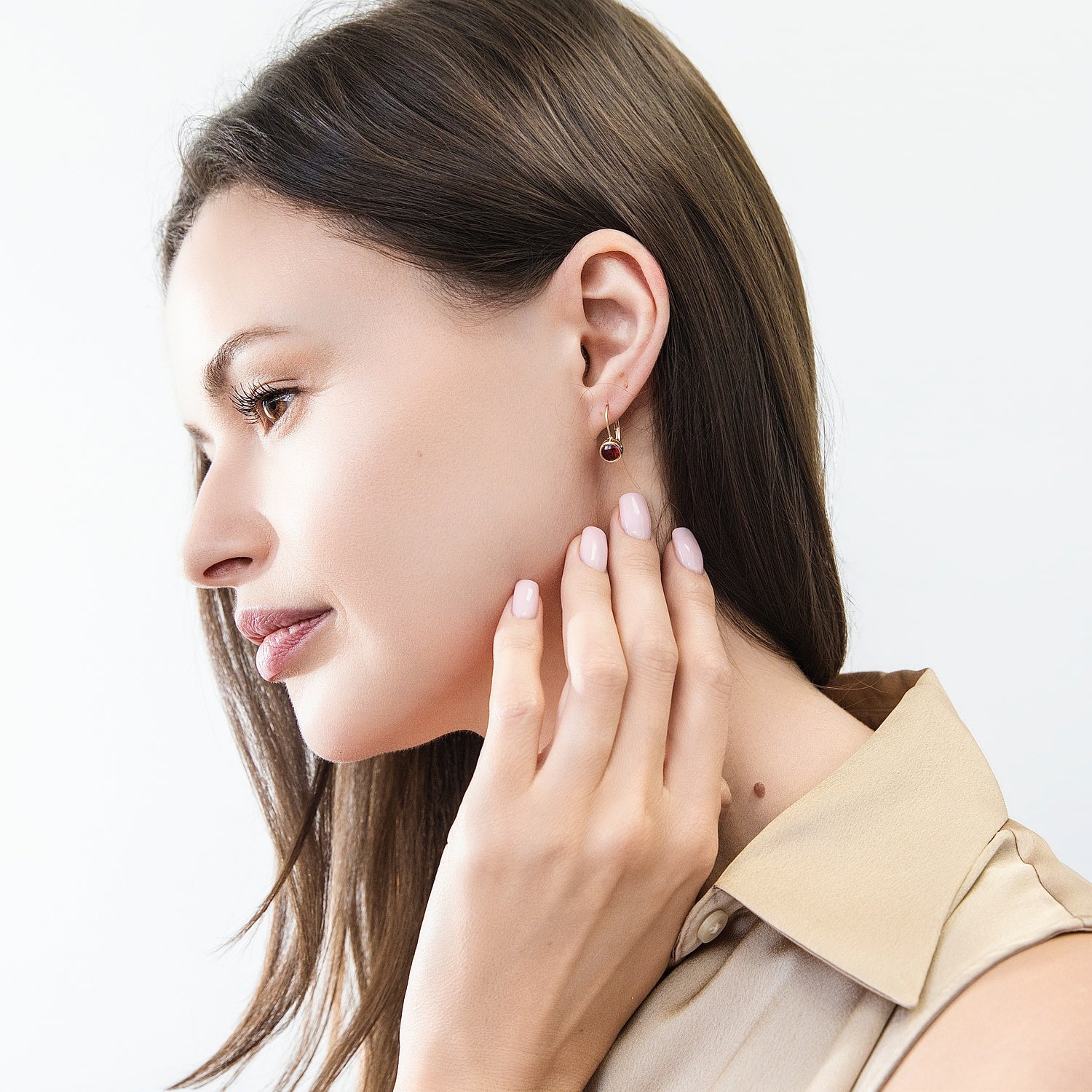 Model wearing Solitaire 1.2ct Bezel CZ Leverback Earrings in Sterling Silver, Ruby, Gold Flashed