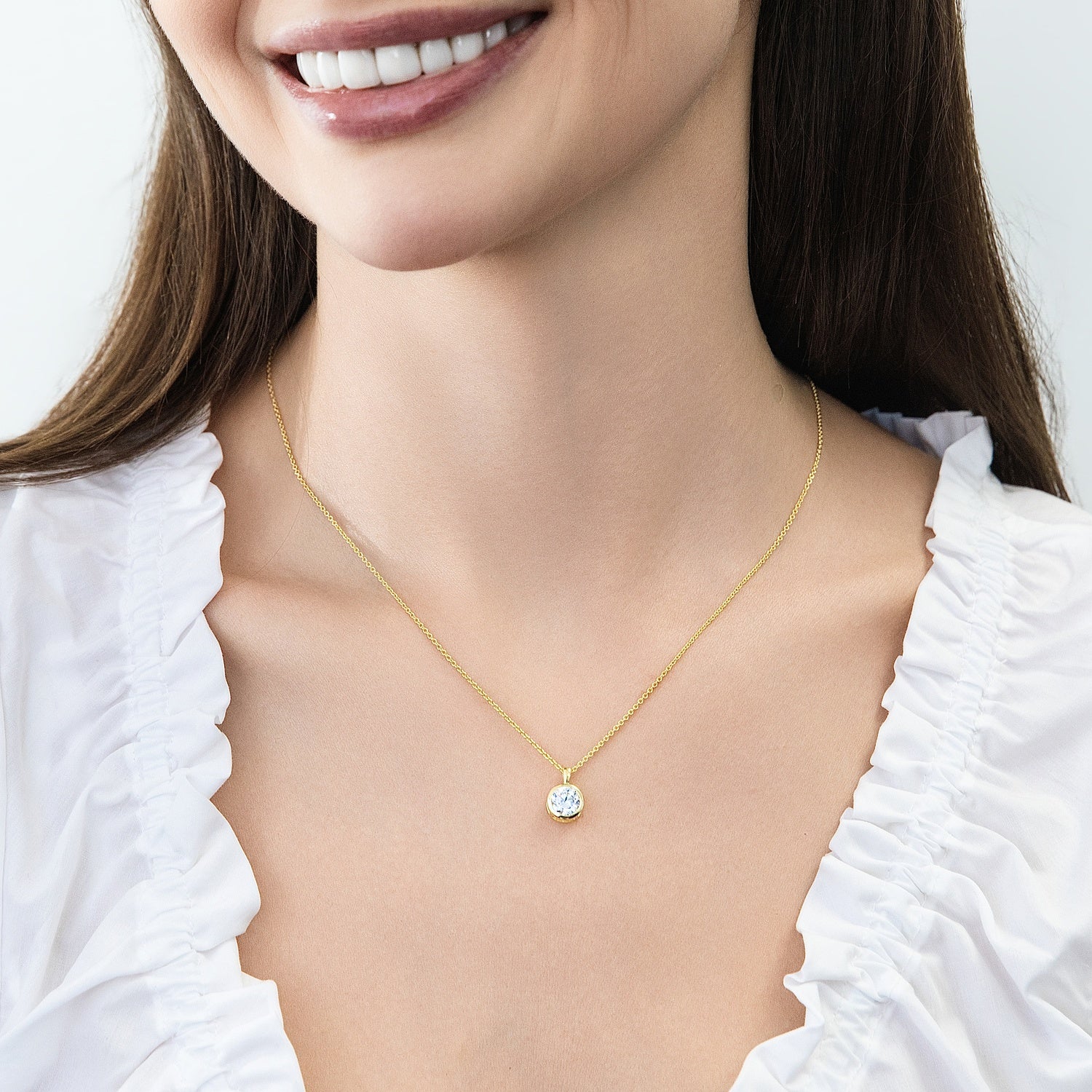 Model wearing Solitaire 1.25ct Bezel CZ Necklace in Sterling Silver, Gold Flashed