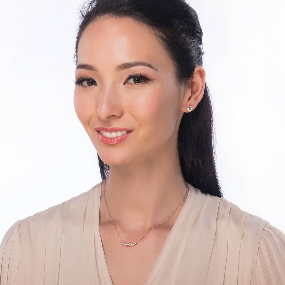Model wearing Solitaire Cartilage CZ Cartilage Stud Earrings in Sterling Silver, Rose Gold Flashed