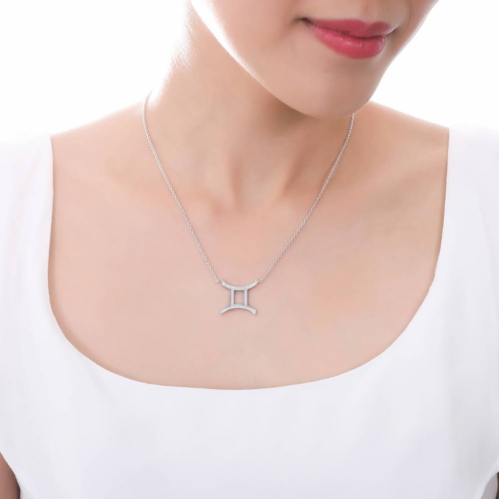 Model wearing Zodiac CZ Pendant Necklace in Sterling Silver, Aquarius