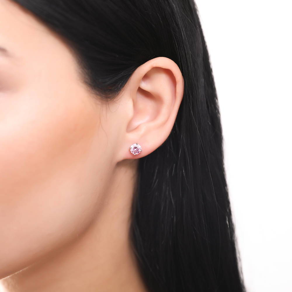 Model wearing Solitaire 1.6ct CZ Cartilage Stud Earrings in Sterling Silver, Pink
