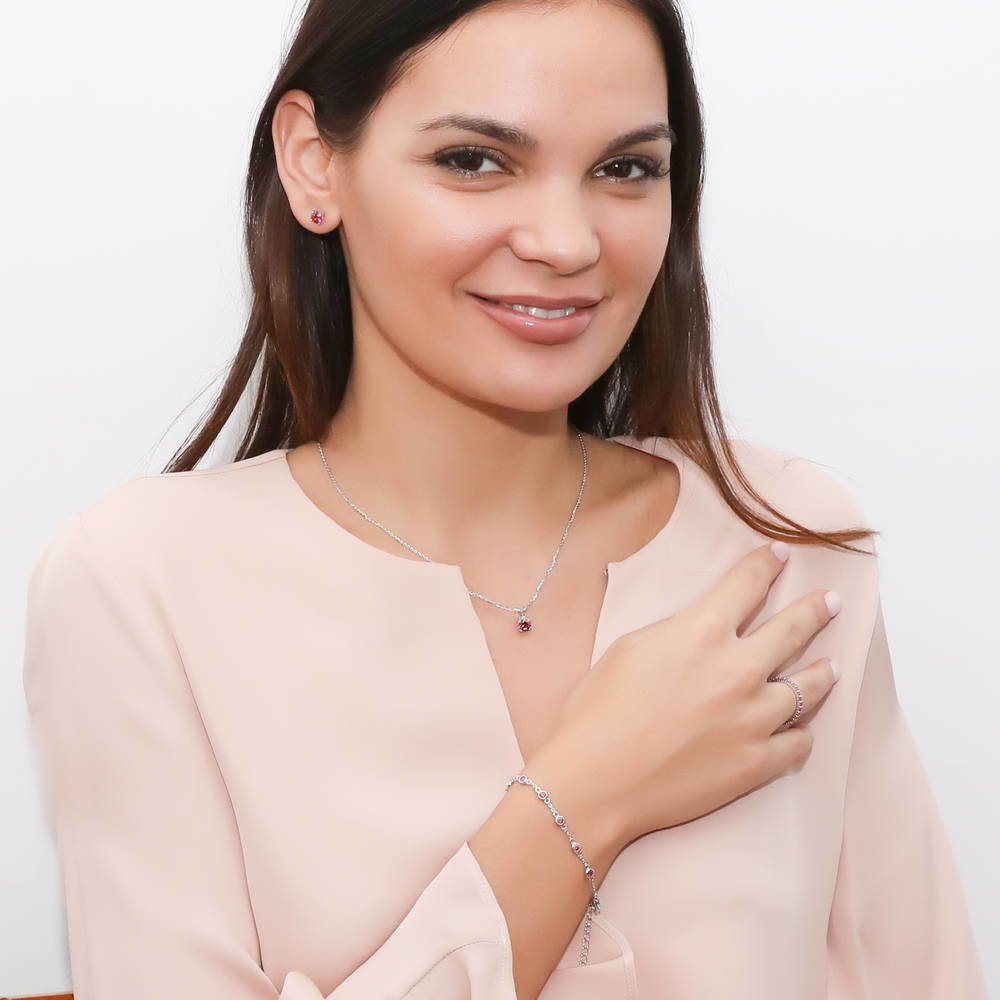 Model wearing Solitaire 1.6ct CZ Cartilage Stud Earrings in Sterling Silver, Red