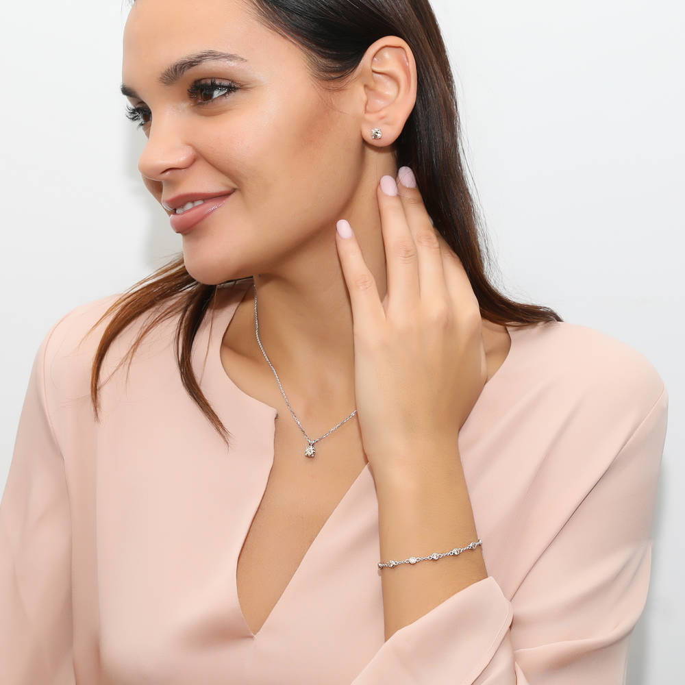 Model wearing Solitaire 1.6ct CZ Cartilage Stud Earrings in Sterling Silver, Yellow