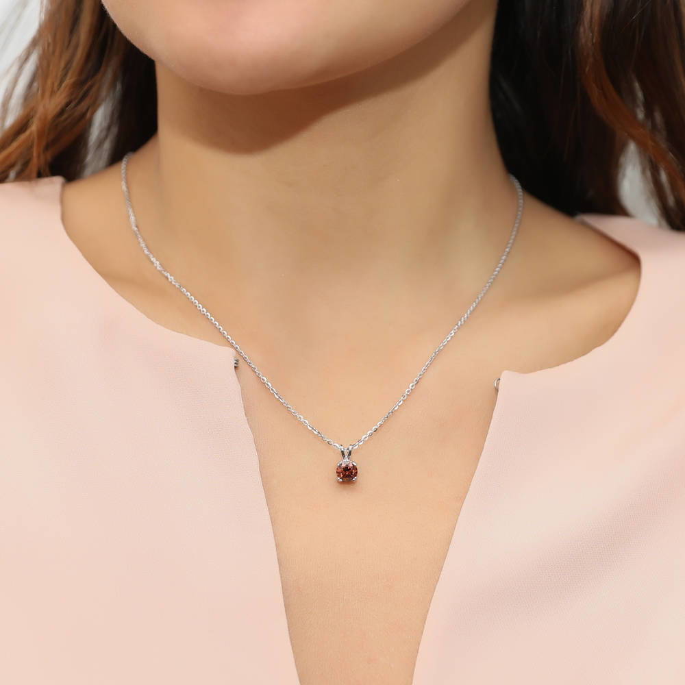 Model wearing Solitaire CZ Necklace in Sterling Silver, Round Cut / Caramel