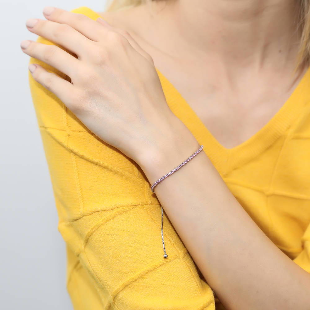 Model wearing CZ Tennis Bracelet Gold Flashed, Pink Color