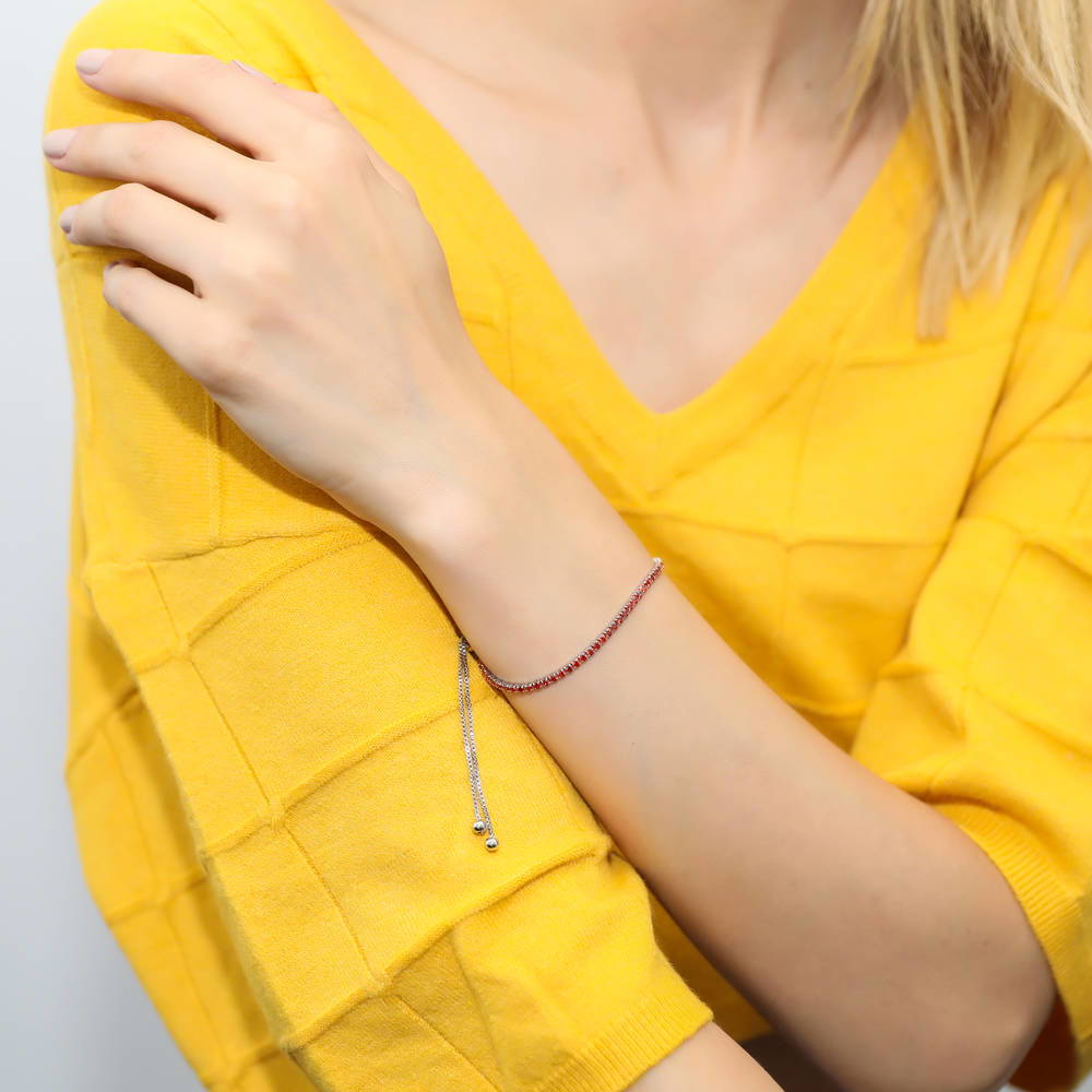 Model wearing CZ Tennis Bracelet Gold Flashed, Red Color