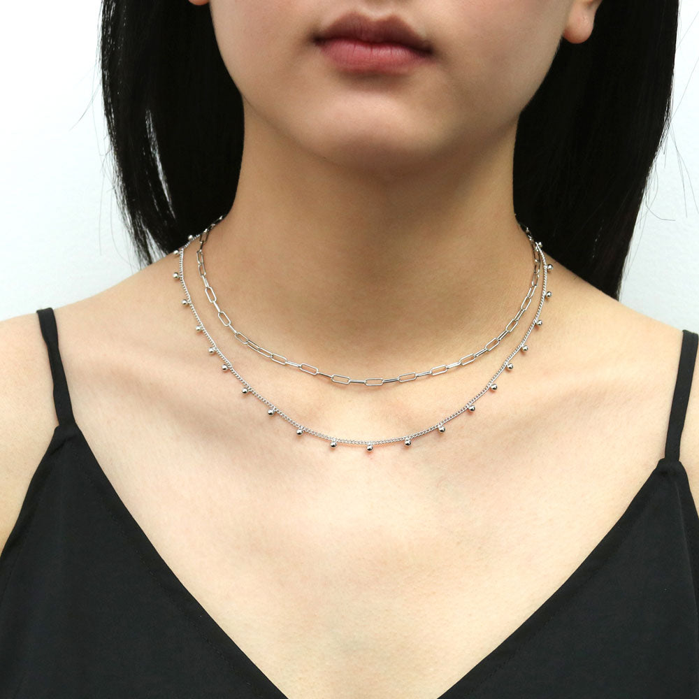 Model wearing Bead Station Necklace, Rhodium Plated