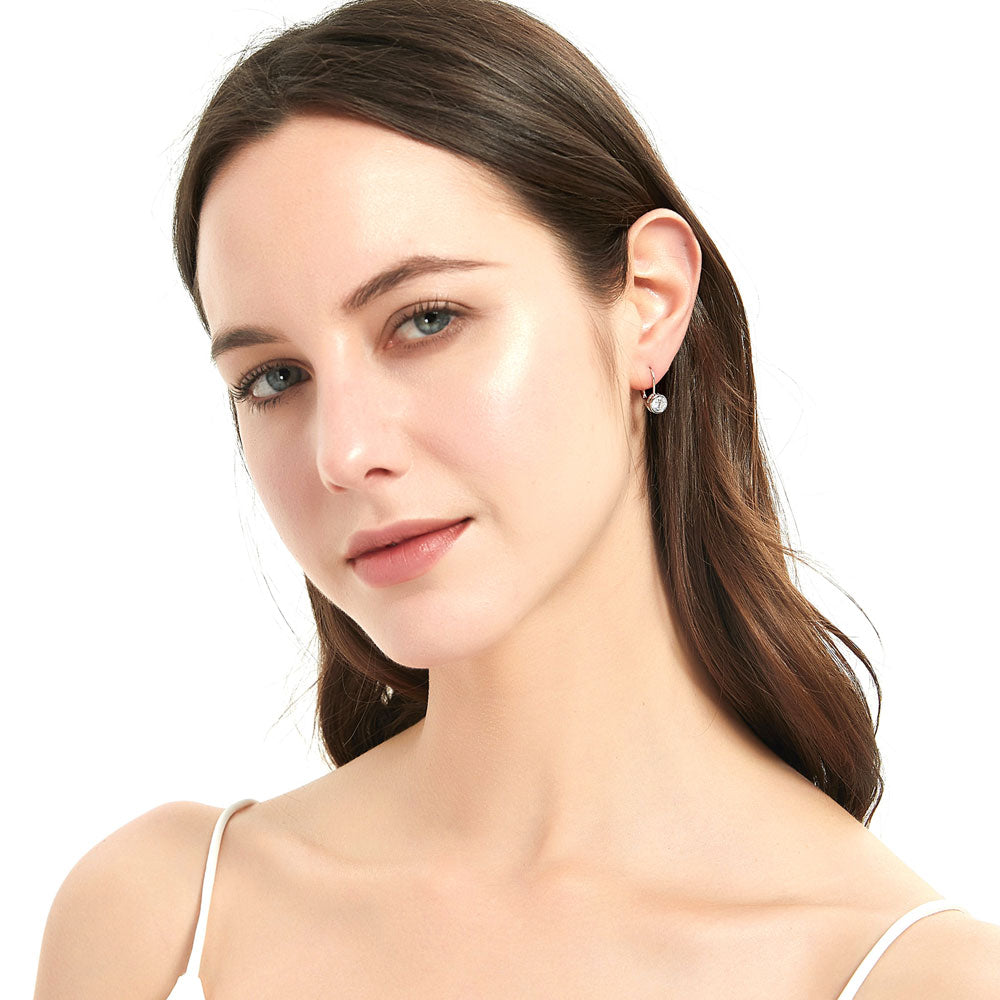 Model Wearing Solitaire Dangle Earrings