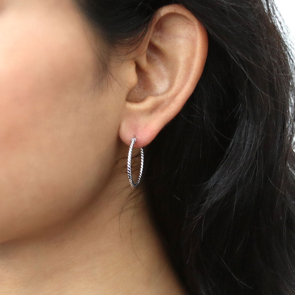 Model wearing Cable Small Hoop Earrings in Sterling Silver 0.9 inch, Yellow Gold Flashed