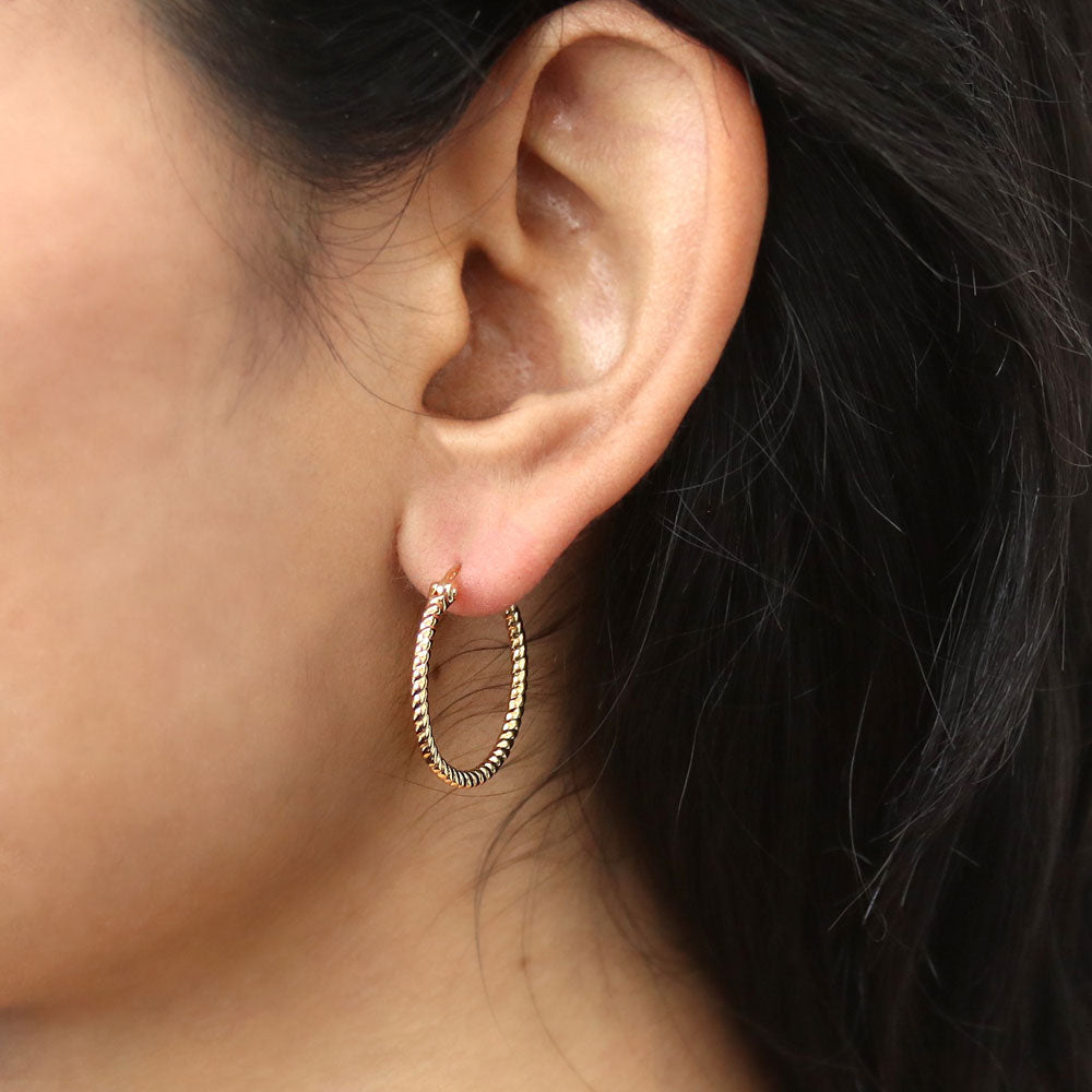Model wearing Cable Small Hoop Earrings in Sterling Silver 0.9 inch, Yellow Gold Flashed