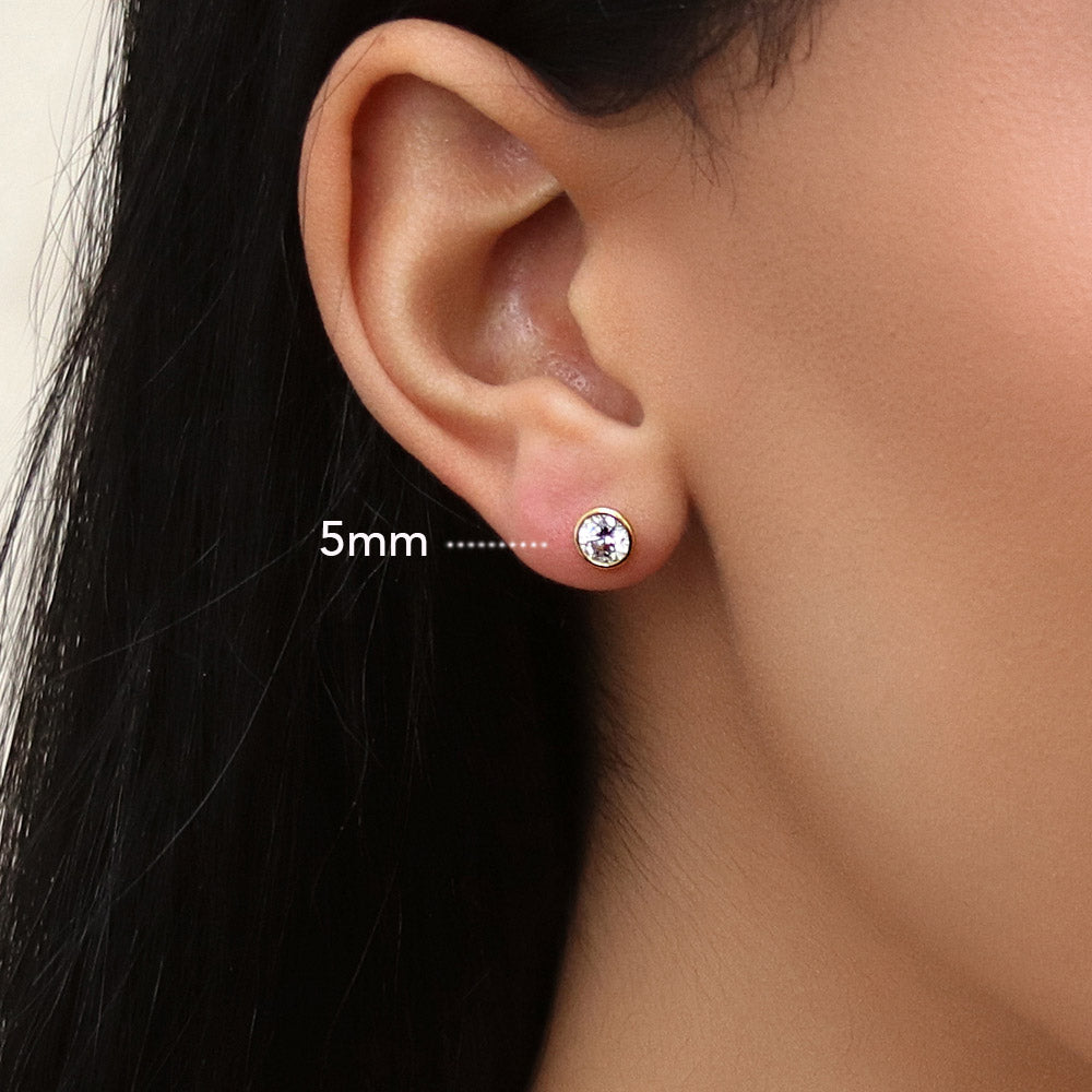 Model wearing Solitaire Bezel CZ Stud Earrings in Gold Flashed Sterling Silver, 5mm