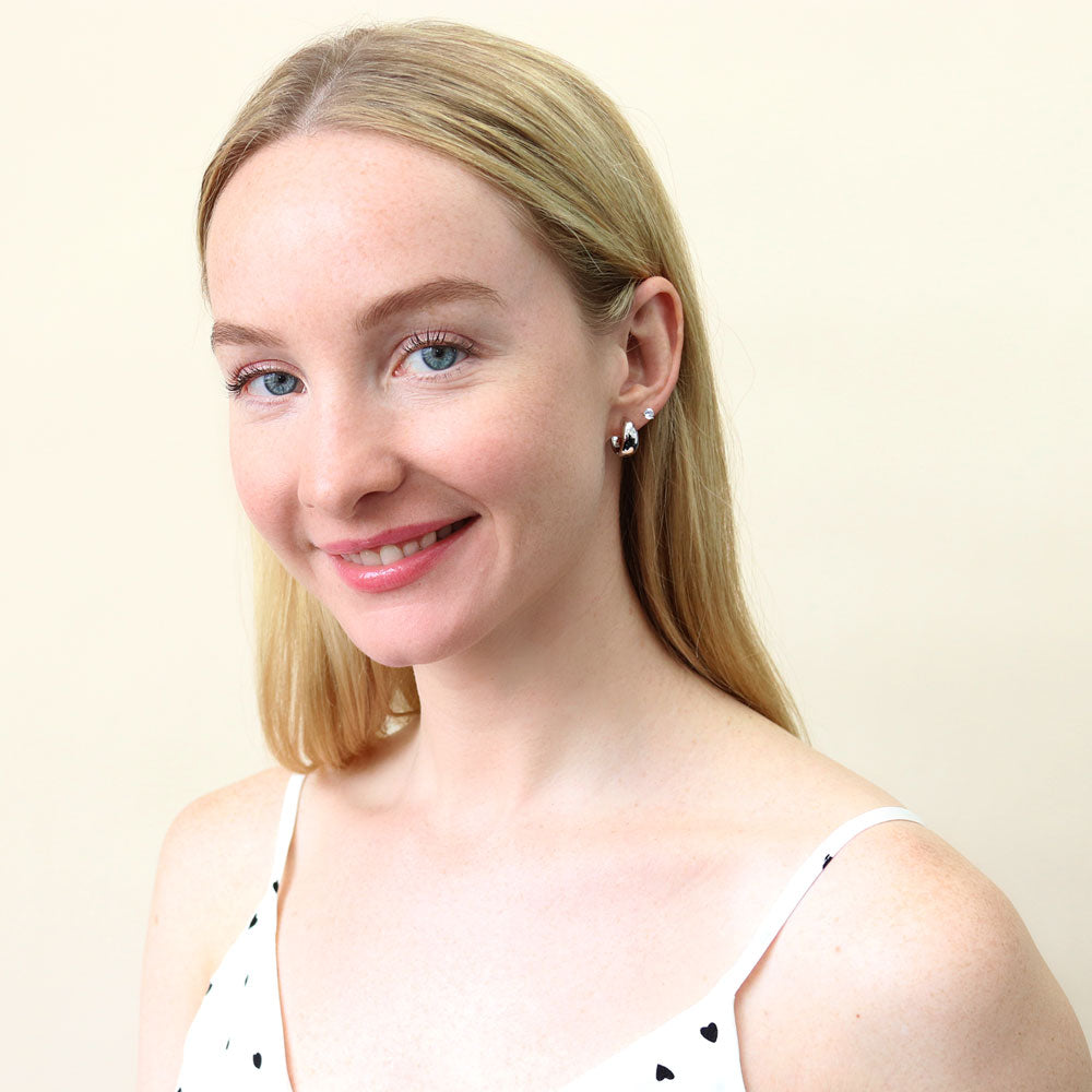 Model wearing Dome CZ Small Huggie Earrings in Sterling Silver 0.6 inch, Rhodium Plated