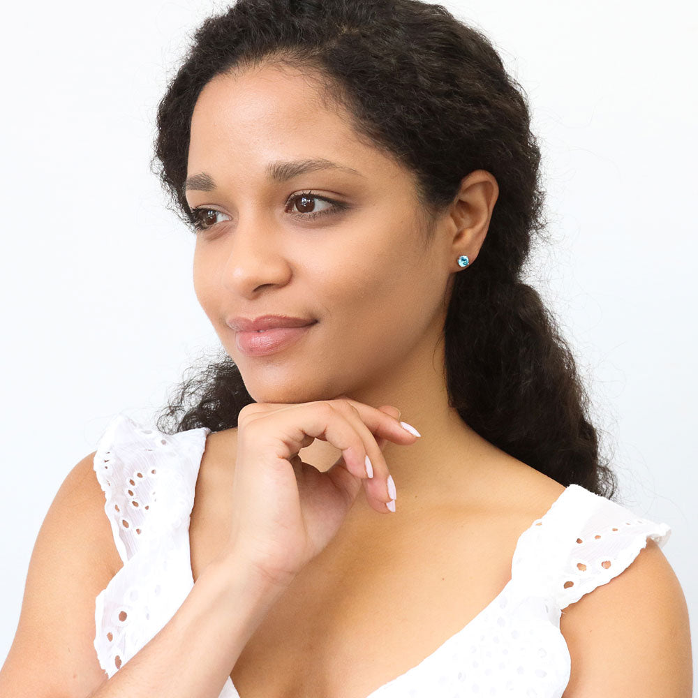 Model wearing Solitaire 1.6ct CZ Cartilage Stud Earrings in Sterling Silver, Aquamarine Color