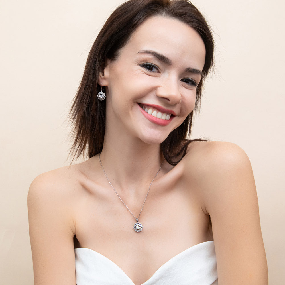Model wearing Flower Ribbon CZ Necklace and Earrings Set in Sterling Silver, 2 of 11