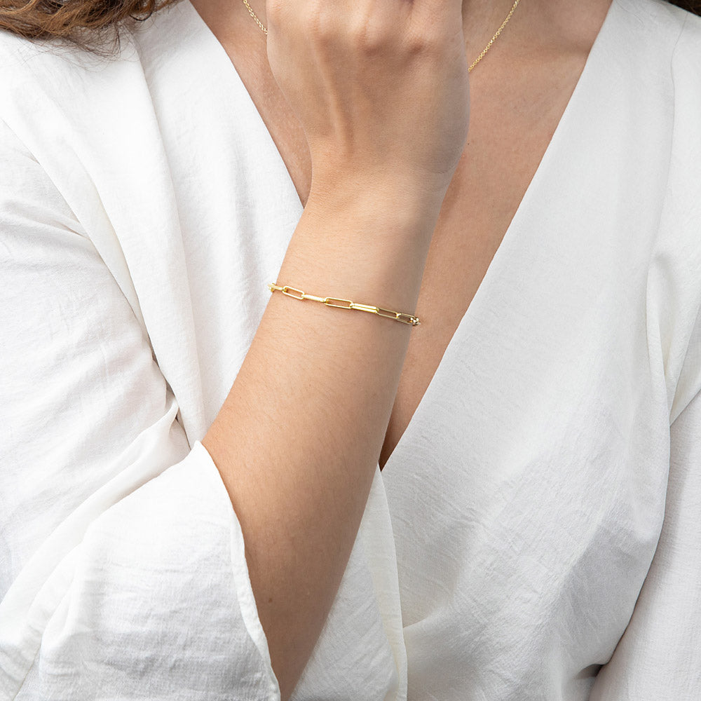 Model wearing Paperclip Link Chain Bracelet in Sterling Silver 3mm, Yellow Gold Flashed