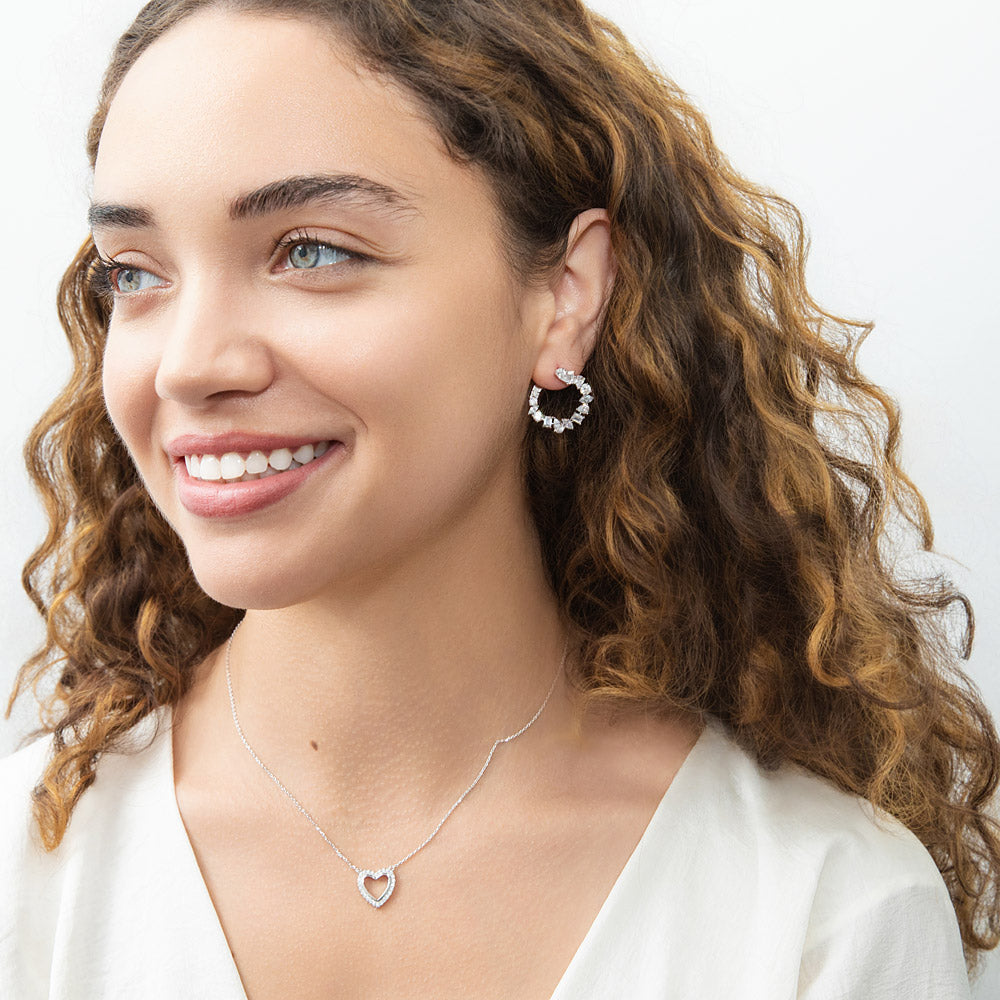 Model wearing Open Heart CZ Necklace in Sterling Silver, Yellow Gold Flashed