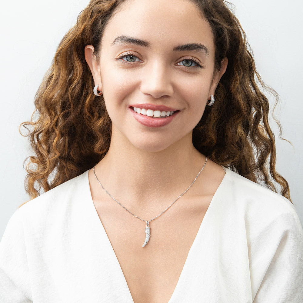 Model Wearing Dome Hoop Huggie Earrings, Horn Pendant Necklace