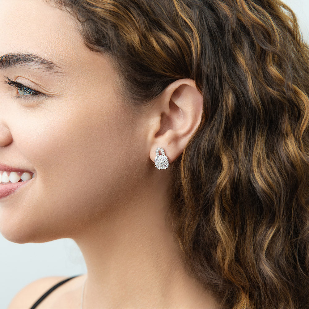 Model wearing Key and Lock CZ Stud Earrings in Sterling Silver, Clear Color