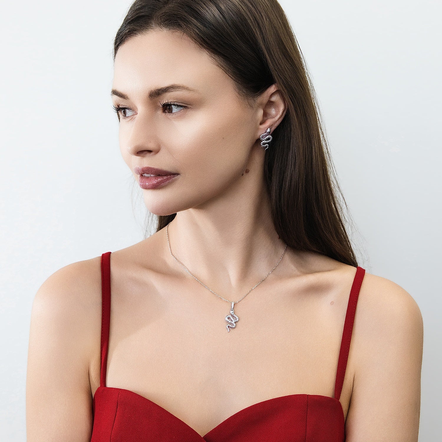 Model wearing Snake CZ Necklace and Earrings in Sterling Silver, Rhodium Plated