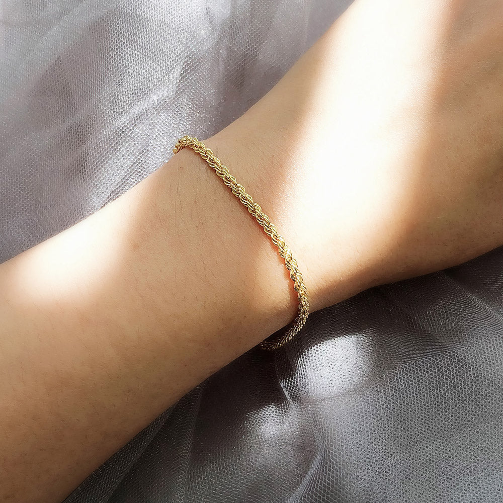 Model wearing Twisted Rope Chain Bracelet in Sterling Silver 3mm, Yellow Gold Flashed
