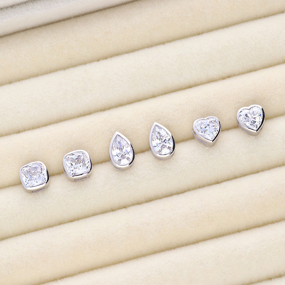 Flatlay view of Solitaire Bezel Set Pear CZ Stud Earrings in Sterling Silver 1.6ct, 6 of 6