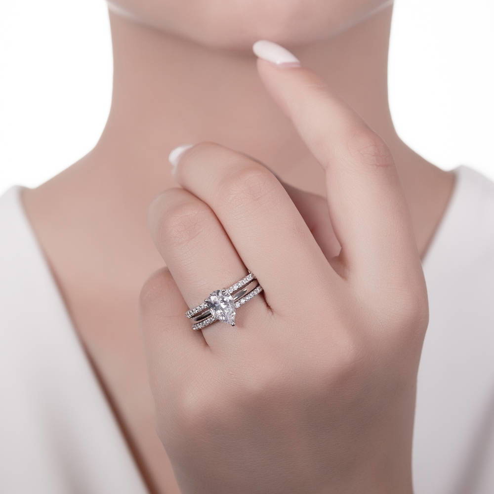 Model wearing Solitaire 1.8ct Pear CZ Ring Set in Sterling Silver, 2 of 14