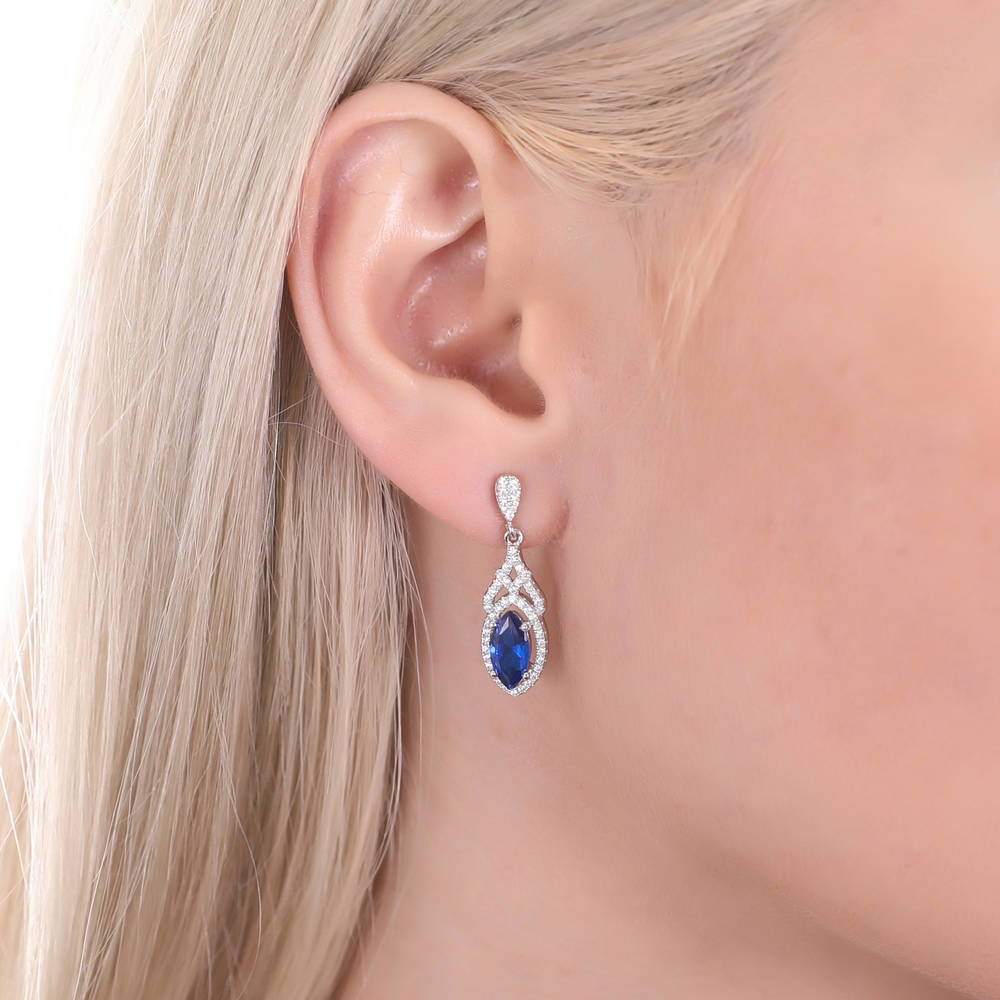 Model wearing Halo Simulated Blue Sapphire Marquise CZ Set in Sterling Silver, 6 of 8