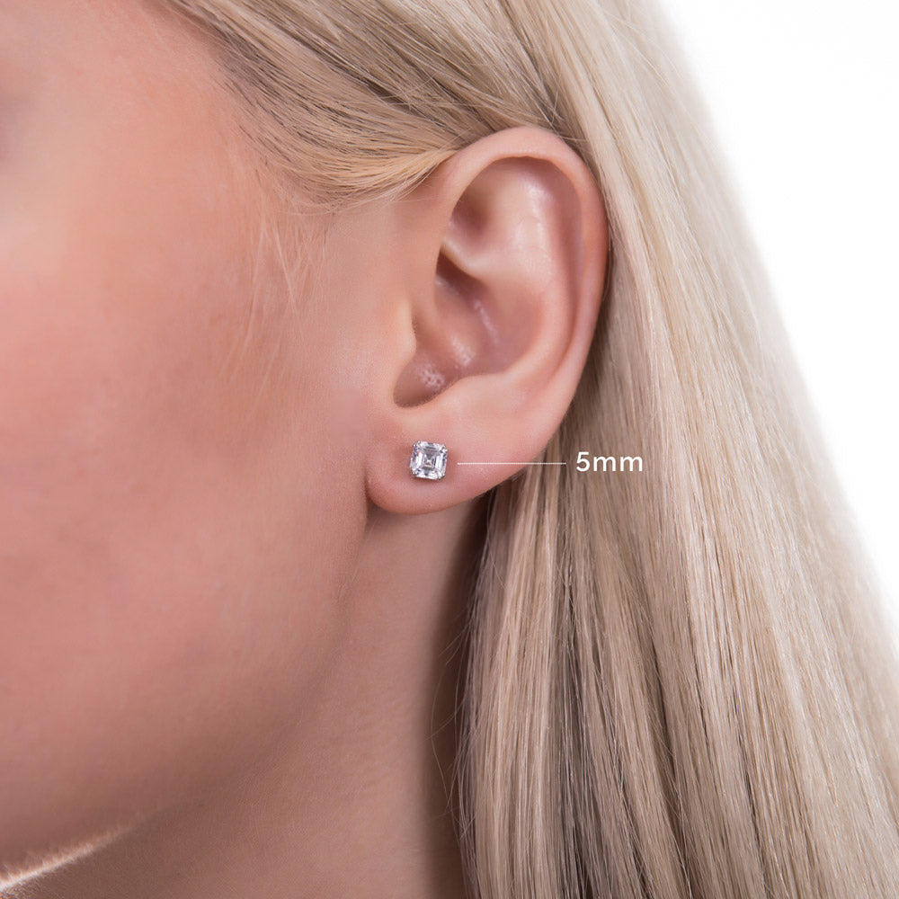 Model wearing Solitaire Asscher CZ Stud Earrings in Sterling Silver, 4mm