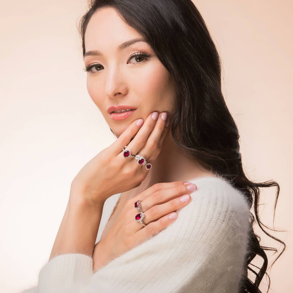 Model wearing 3-Stone Simulated Ruby Cushion CZ Ring in Sterling Silver, 7 of 9