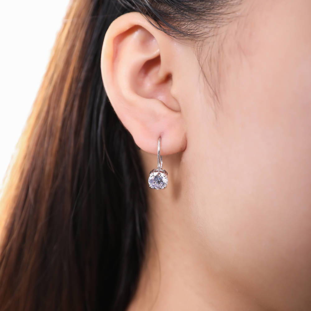 Model wearing Solitaire CZ Leverback Earrings in Sterling Silver, Rhodium Plated / 7mm