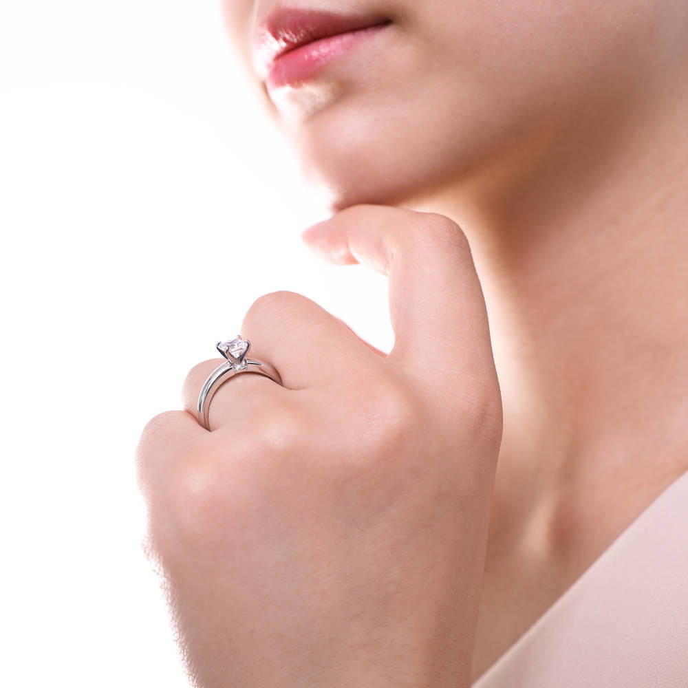 Model wearing Solitaire 1.2ct Princess CZ Ring in Sterling Silver, 7 of 9