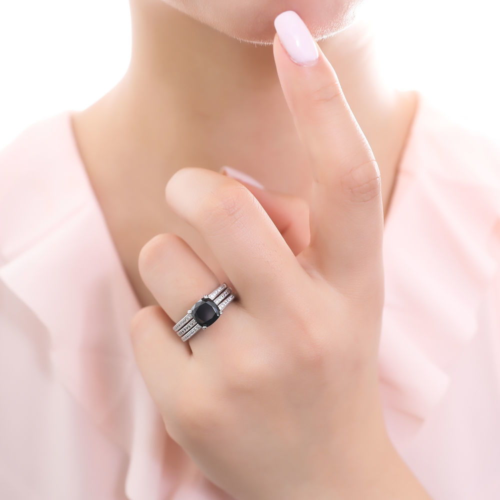 Model wearing Solitaire 3ct Black Cushion CZ Stackable Ring Set in Sterling Silver, 2 of 9