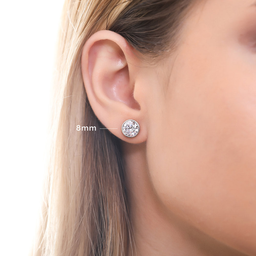 Model wearing Solitaire Bezel CZ Stud Earrings in Sterling Silver, 4mm