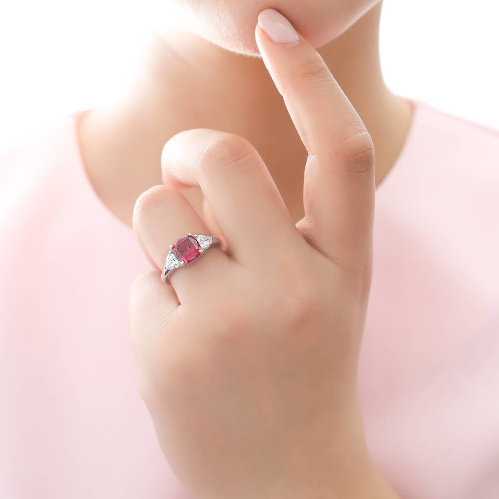 Model wearing 3-Stone Simulated Ruby Cushion CZ Ring in Sterling Silver, 2 of 9