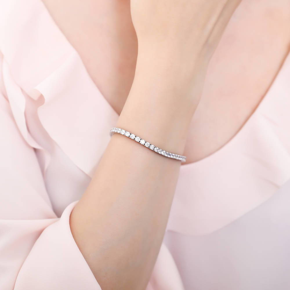 Model wearing Round CZ Tennis Bracelet, Rhodium Plated / 6.5 inch