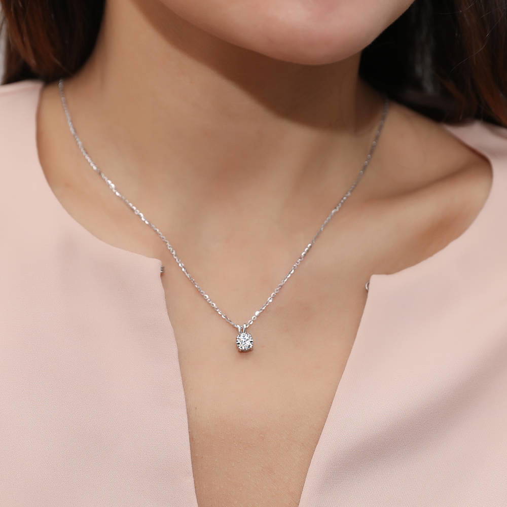 Model wearing Solitaire Round CZ Necklace and Earrings Set in Sterling Silver, 2 of 11