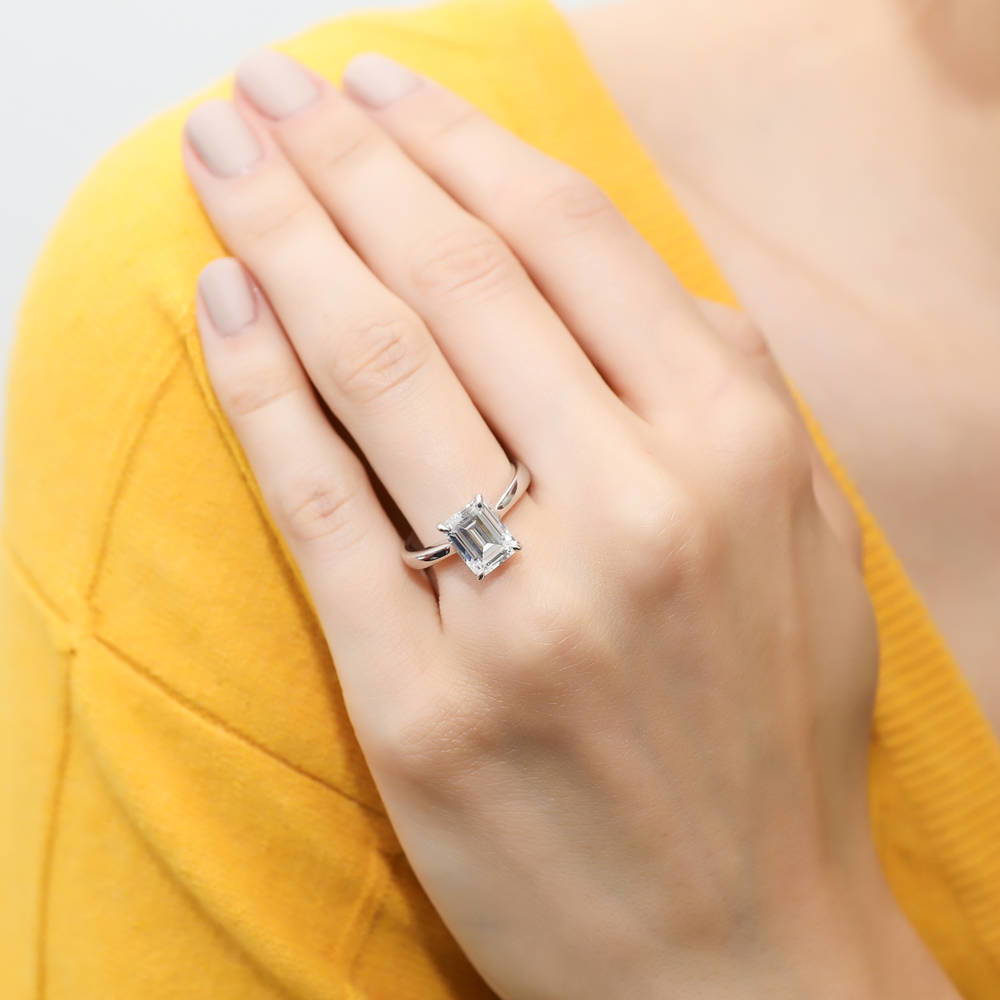 Model wearing Solitaire 2.6ct Emerald Cut CZ Ring Set in Sterling Silver, 7 of 15